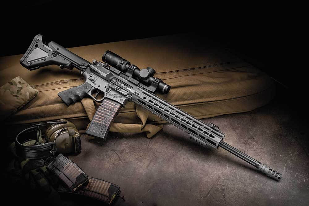 image of ar 15 with scope and hearing protection