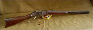 A picture of the .44-40 Winchester Rifle with ammo