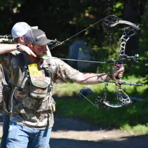 image of a man using his compound bow for hunting