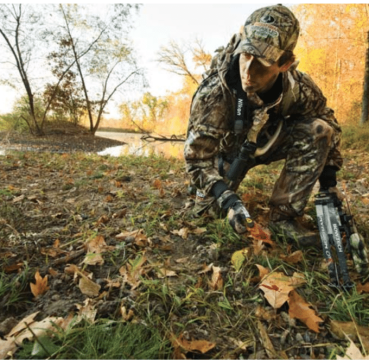 image of a bowhunter tracking for something