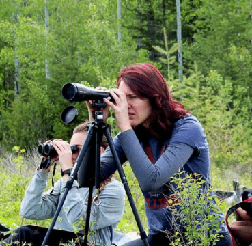 image of a woman sighting Nightforce spotting scope