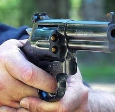 a picture of someone shooting a 357 magnum revolver