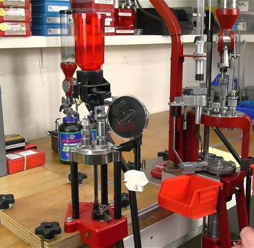 image showing a garage with a reloading press