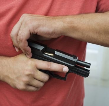Man loads a gun pistol