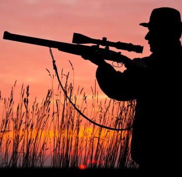 Image of a man holding rifle silhouette