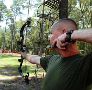 image of a man using a bow hunting sight