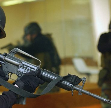 image of tactical unit holding his ar14